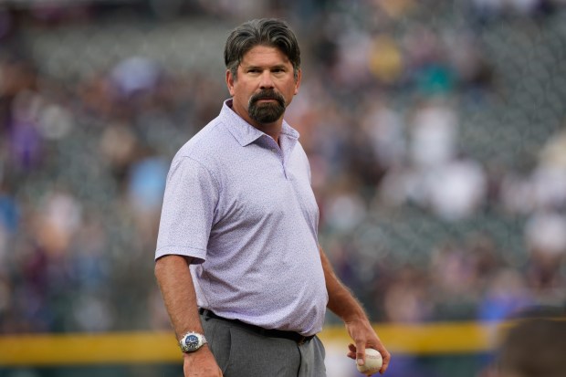 Retired Colorado Rockies first baseman Todd Helton waits to throw out the ceremonial first pitch before a baseball game Saturday, Aug. 19, 2023, in Denver. (AP Photo/David Zalubowski)