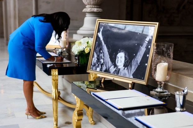San Francisco Mayor London Breed signs a sheet and as she pays her respects to Senator Diane Feinstein in a remembrance signing table at the San Francisco City Hall in San Francisco, Calif., on Friday, Sept. 30, 2023. Feinstein, who was the longest serving US senator, died at the age of 90. She was a supervisor and first female mayor of San Francisco before she became a senator. Breed follows Feinstein's legacy as she is second female mayor in San Francisco history. (Ray Chavez/Bay Area News Group)