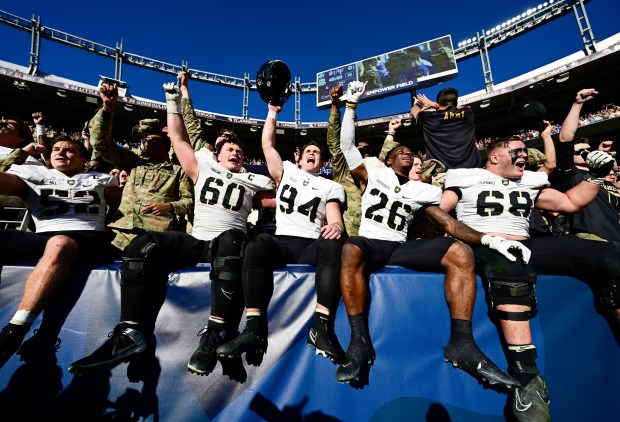 Army Black Knights defensive lineman Austin Hill (52), Connor Finucanein (60), Cole Talley, (94), Quindrelin Hammonds (26) and Jackson Filipowicz (68) sing their fight song after defeating the Air Force Falcons 23-3 at Empower Field at Mile High Stadium November 04, 2023. (Photo by Andy Cross/The Denver Post)