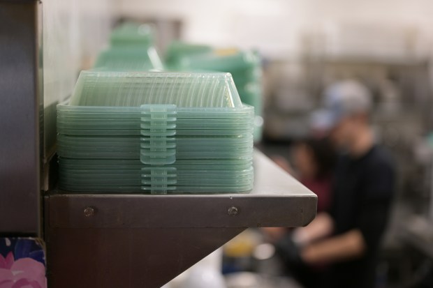 DeliverZero reusable to-go containers are seen at Chook Chicken restaurant in Denver on Tuesday, November 14, 2023. The restaurant offers DeliverZero reusable to-go containers and return stations. (Photo by Hyoung Chang/The Denver Post)