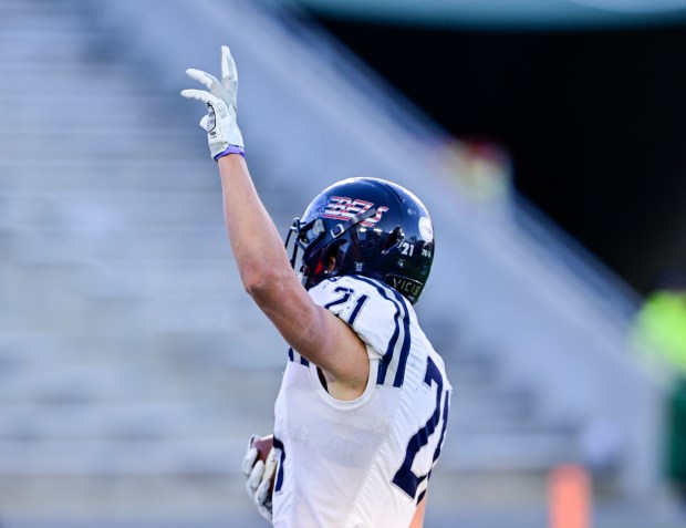 Columbine Rebels RB Josh Snyder (21) celebrates his touchdown against the Cherry Creek Bruins in the second quarter of the 5A Colorado State Championship football game at Canvas Stadium in Ft. Collins on Saturday Dec. 02, 2023. (Photo by Andy Cross/The Denver Post)
