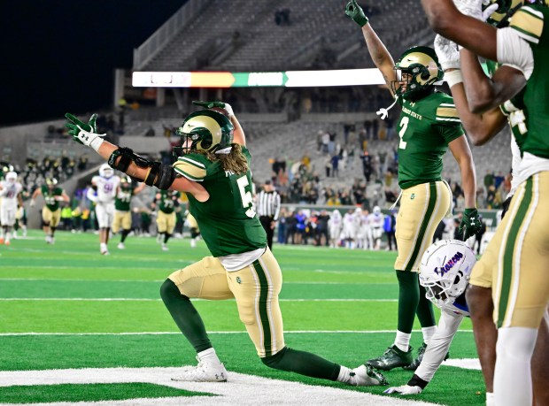 Colorado State Rams tight end Dallin Holker (5), left, celebrates after catching a Hail Mary pass in the end zone against the Boise State Broncos in the fourth quarter at Canvas Stadium in Ft. Collins October 14, 2023. Colorado State Rams wide receiver Justus Ross-Simmons (2), right, joins the celebration. After the extra point, the Rams won 30-31. (Photo by Andy Cross/The Denver Post)