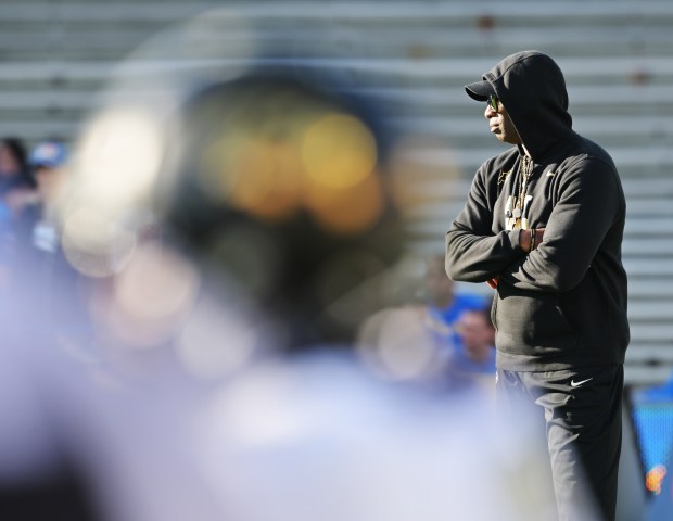 Head Coach Deion Sanders watches warmups as the Colorado Buffaloes get ready to take on the UCLA Bruins at Rose Bowl Stadium on Oct. 28, 2023, in Pasadena, Calif. (Photo by RJ Sangosti/The Denver Post)