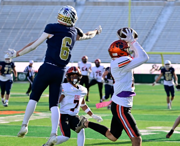Erie Tigers defender Noah Garcia (14) intercepts a pass intended for Palmer Ridge Bears WR James Weir (6) in fourth the quarter of the 4A Colorado State Championship football game at Canvas Stadium in Ft. Collins on Saturday Dec. 2, 2023. (Photo by Andy Cross/The Denver Post)