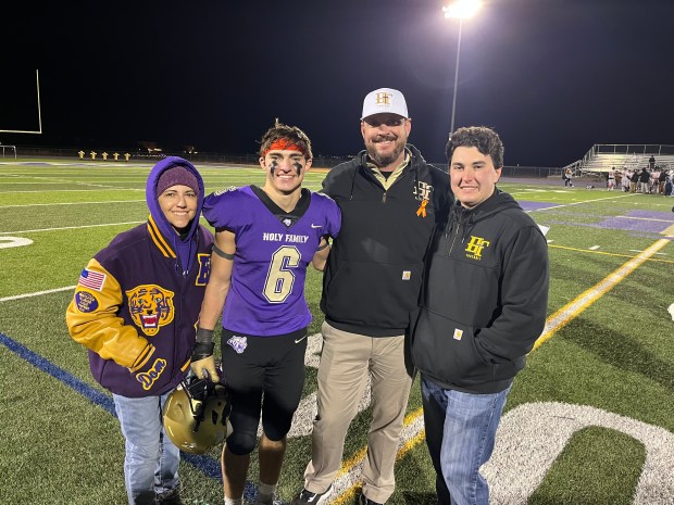 The Gabriel family poses for a portrait after Holy Family's win over Lewis-Palmer in the Class 3A quarterfinals on Friday, Nov. 17, 2023, at Mike G. Gabriel Stadium in Broomfield, Colorado. From left to right: Crystal Gabriel, Dominic Gabriel, Mike D. Gabriel and Rocco Gabriel. (Courtesy of Holy Family Athletics)